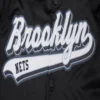 Brooklyn-Nets-Script-Tail-Full-Snap-Satin-Varsity-Jacket-Black-1